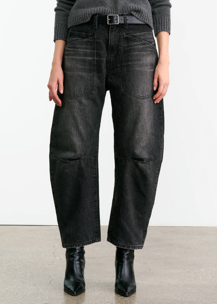 Person wearing Nili Lotan womens denim Shon Jean in Stone Black Wash