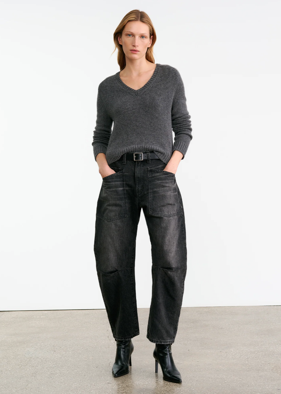 Person wearing Nili Lotan womens denim Shon Jean in Stone Black Wash