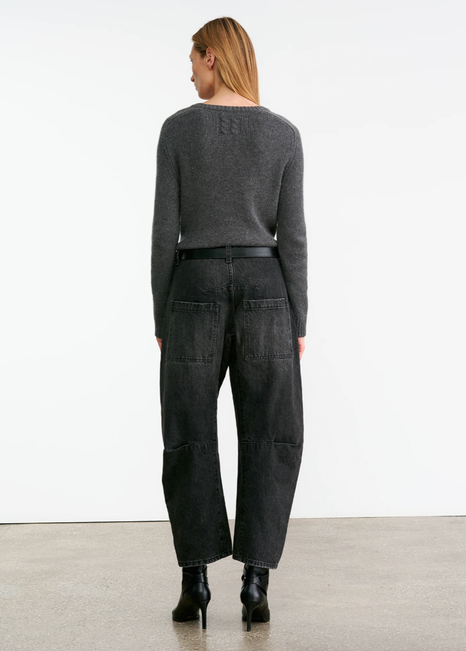 Person wearing Nili Lotan womens denim Shon Jean in Stone Black Wash