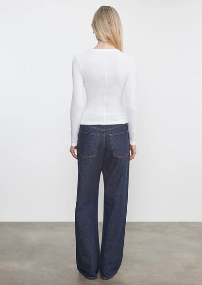 Person wearing Person wearing Enza Costa womens Supima Cotton Long Sleeve Tee in White