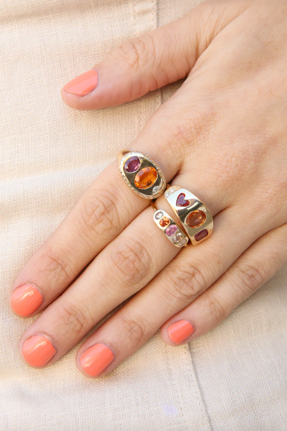 Person wearing SCOSHA Fine jewelry 14k yellow gold Asha Ring with Mixed Sapphires