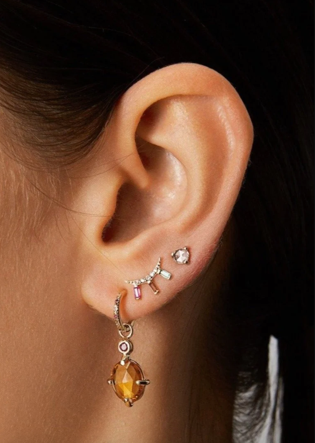 Person wearing SCOSHA Fine jewelry Ariel Rainbow Gemstone Moonbeam Stud