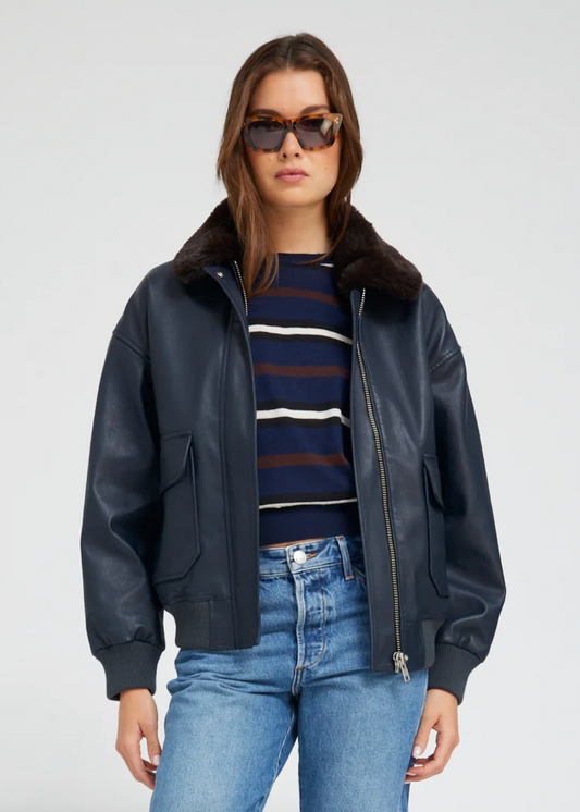 Person wearing SPRMWN womens Midnight Blue Leather Vintage Aviator Jacket with faux fur collar