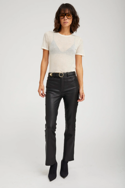 Person wearing SPRWMN 5 Pocket Ankle Flare Pants Black Leather