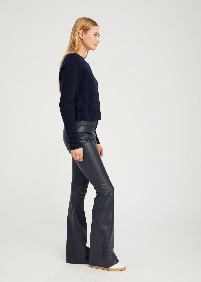 Person wearing SPRWMN 5 Pocket Ankle Flare Pants Midnight Blue Leather
