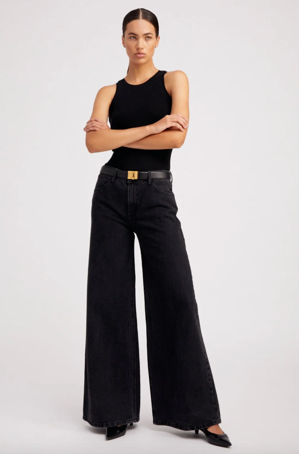 Person wearing SPRWMN 5 Pocket Wide Leg Jeans in Jones Wash