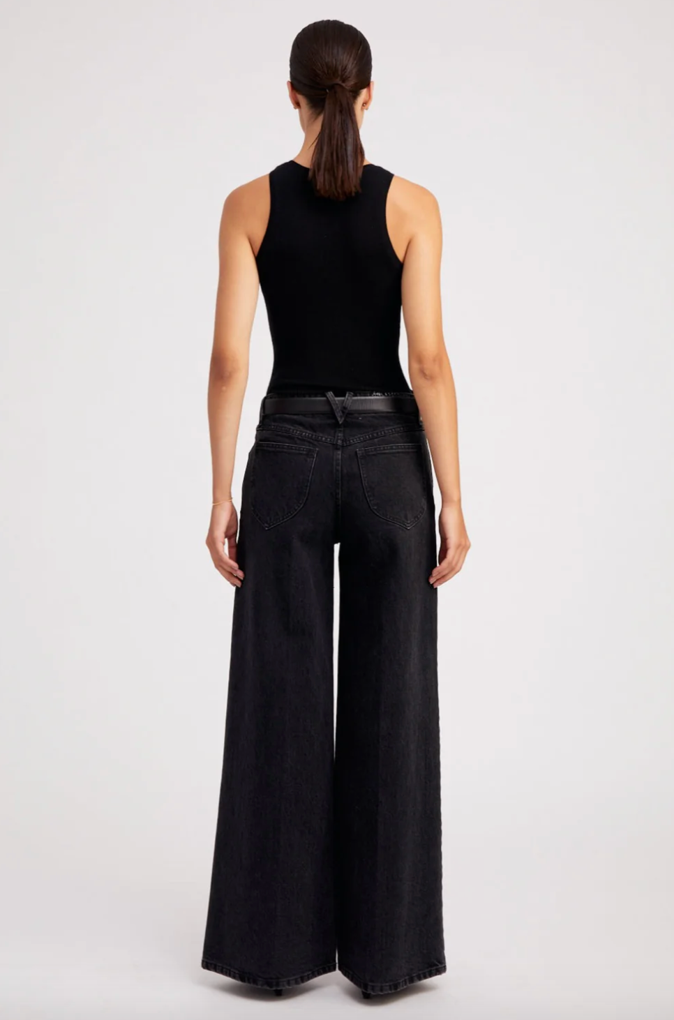 Person wearing SPRWMN 5 Pocket Wide Leg Jeans in Jones Wash