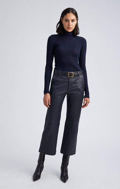 Person wearing SPRWMN Cropped Baggy Trousers in Navy