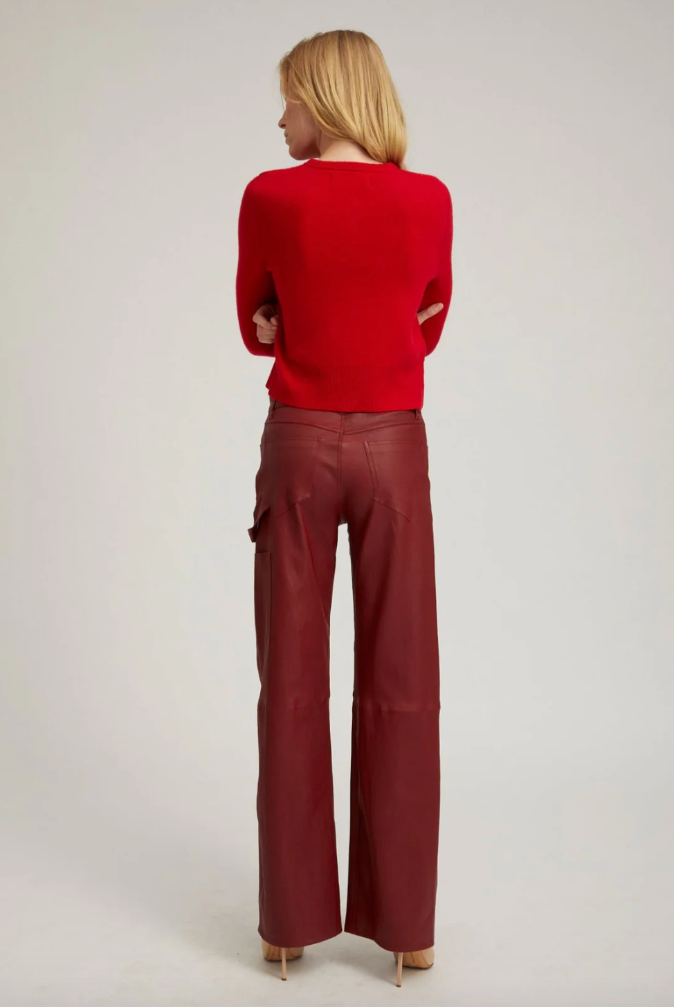 Person wearing SPRWMN Leather Carpenter Pants in Cherry