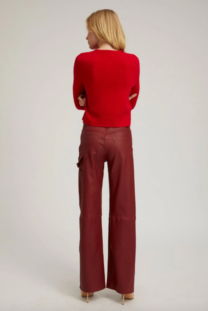 Person wearing SPRWMN Leather Carpenter Pants in Cherry