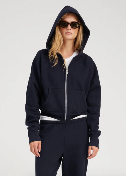 Person wearing SPRWMN Shrunken Zip Up Hoodie in Navy