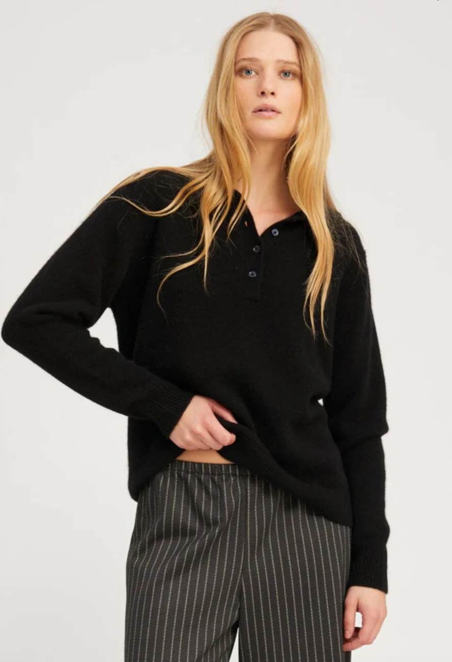 Person wearing SPRWMN womens Cashmere Polo Sweater in Black