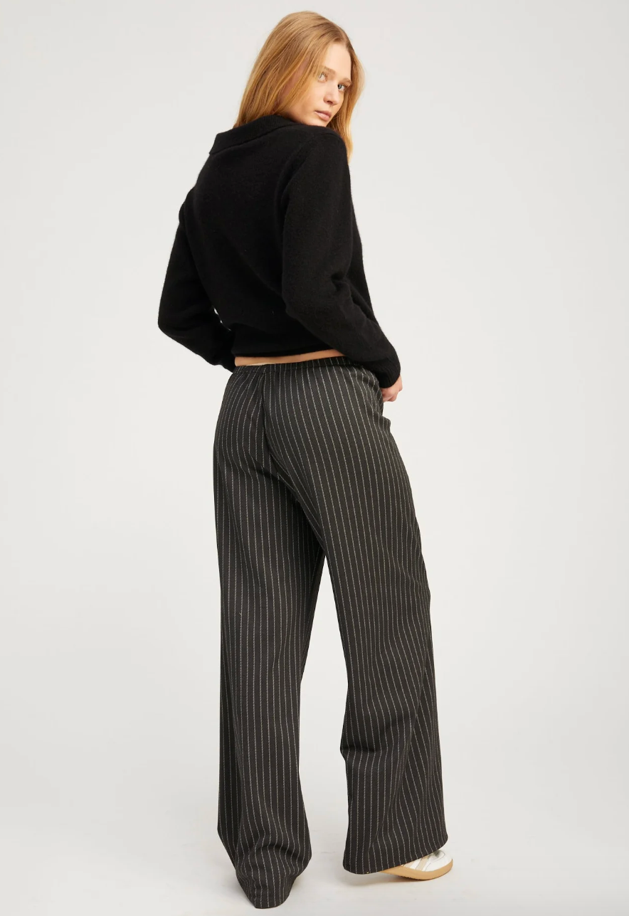 Person wearing SPRWMN womens Cashmere Polo Sweater in Black