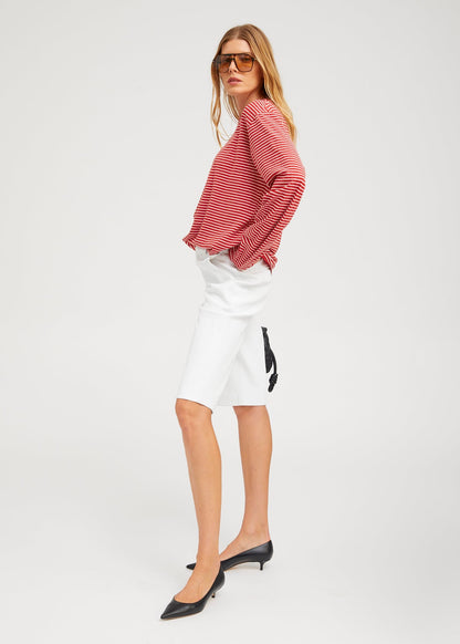person wearing SPRwmn Long Sleeve Oversized Tee red stripes