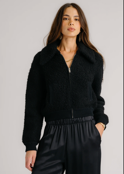 Person wearing Sablyn Black Cashmere Blend Cody Collared Zip Up Jacket