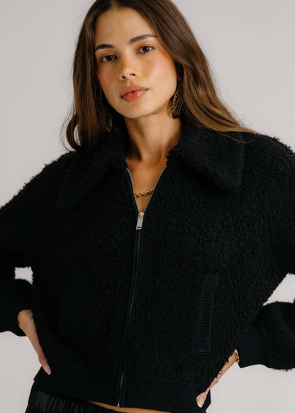 Person wearing Sablyn Black Cashmere Blend Cody Collared Zip Up Jacket