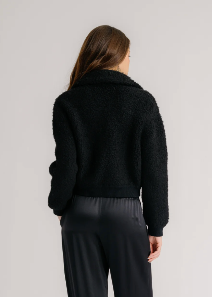 Person wearing Sablyn Black Cashmere Blend Cody Collared Zip Up Jacket