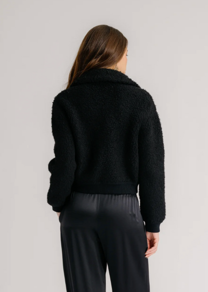 Person wearing Sablyn Black Cashmere Blend Cody Collared Zip Up Jacket