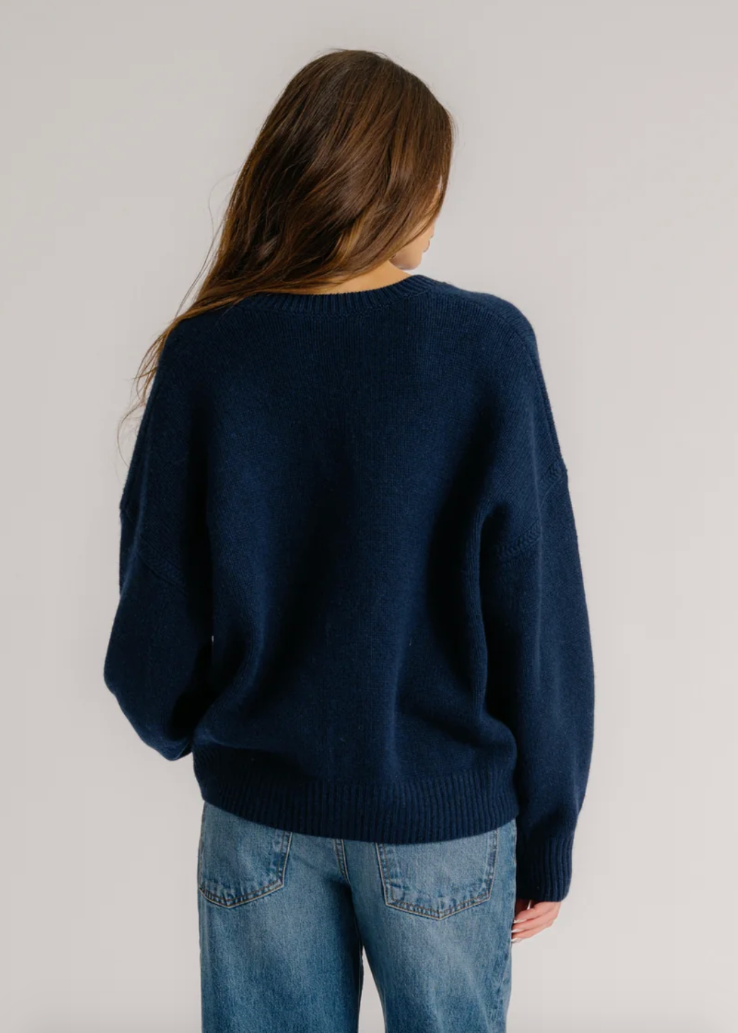 Person wearing Sablyn Cora Cashmere Scoop Neck Sweater in Midnight Navy