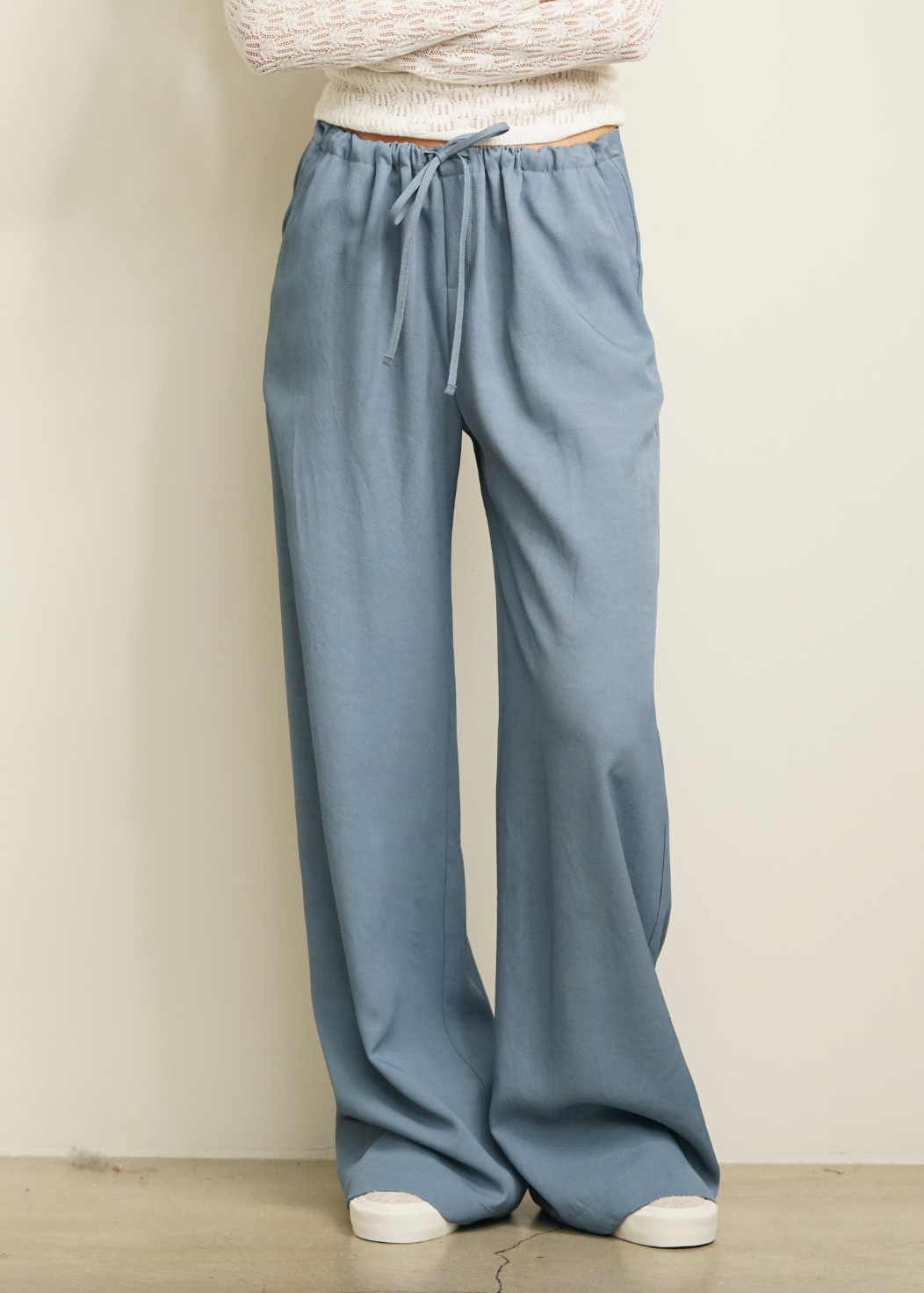 Person wearing Sablyn Gemma Pull On Straight Leg Pant in Smoky Blue