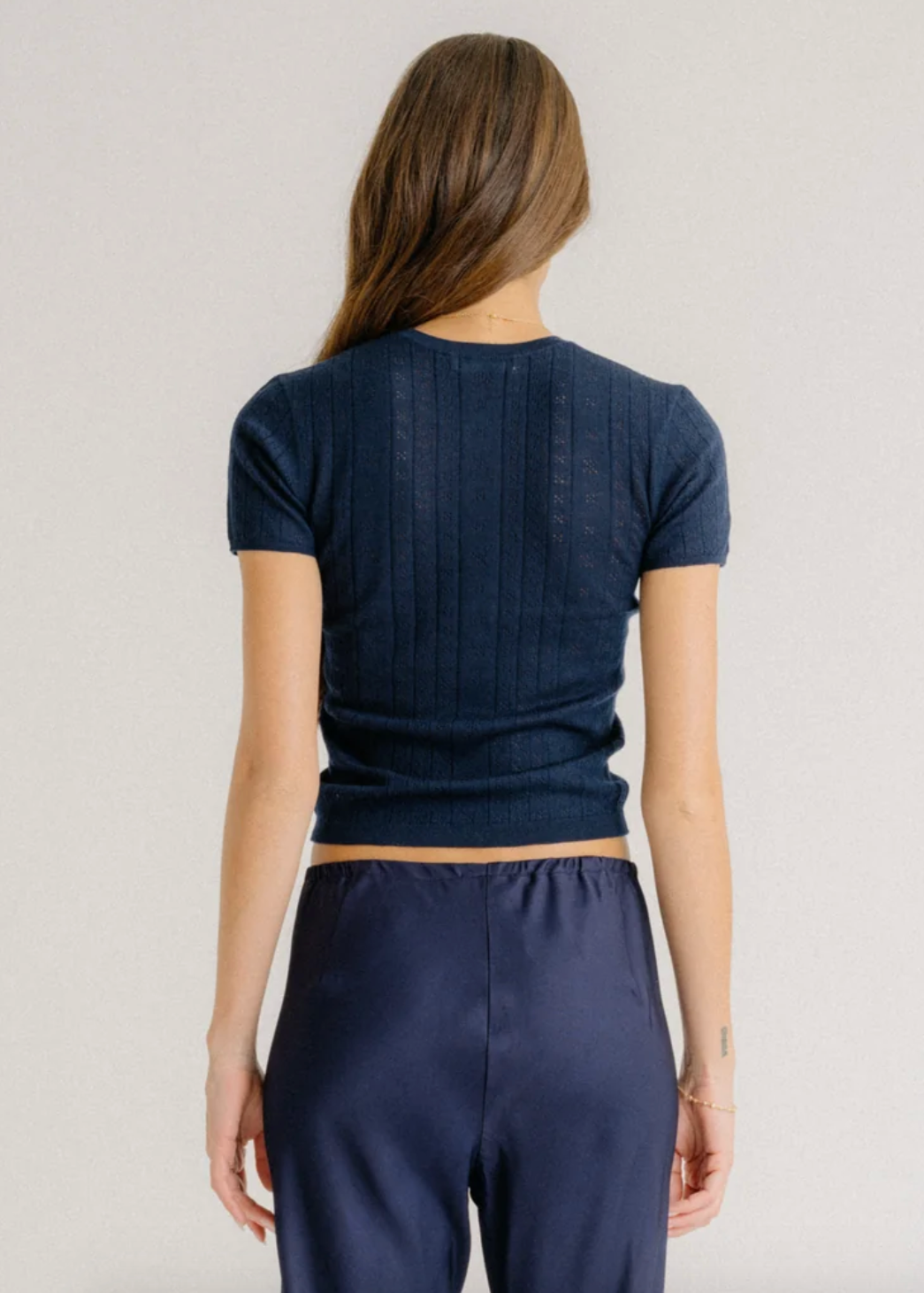 Person wearing Sablyn Isolde Slim Cashmere Crewneck Tee in Midnight