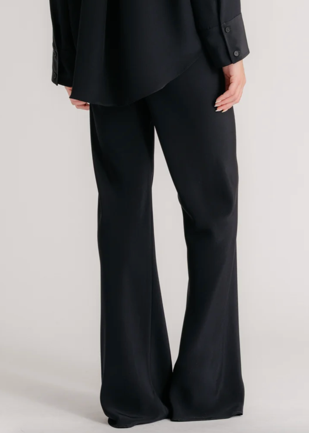 Person wearing Sablyn Rio Flared Bias Cut Pants Viscose Twill Black