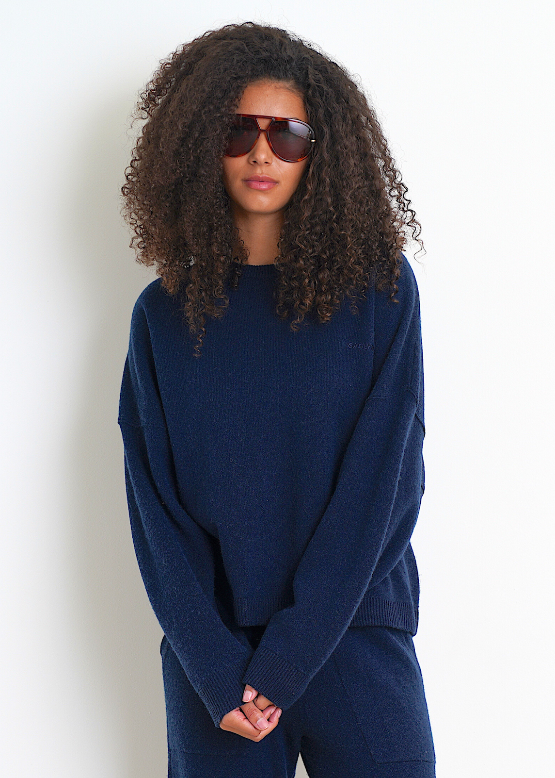 Person wearing Sablyn Romy B Crewneck Sweatshirt in Midnight Navy