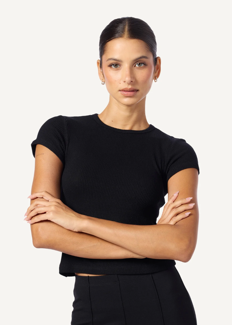 Person wearing Sablyn Yael Fitted Rib Tee Shirt in Black