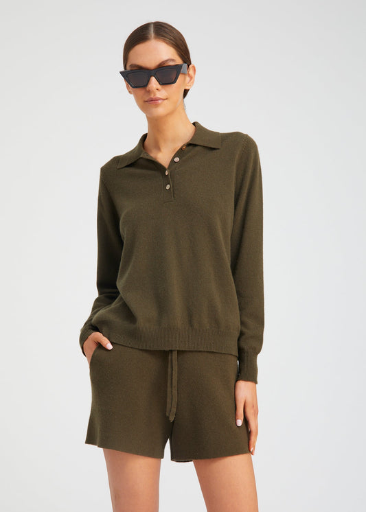 person wearing Sablyn womens Cashmere Polo Sweater in Olive