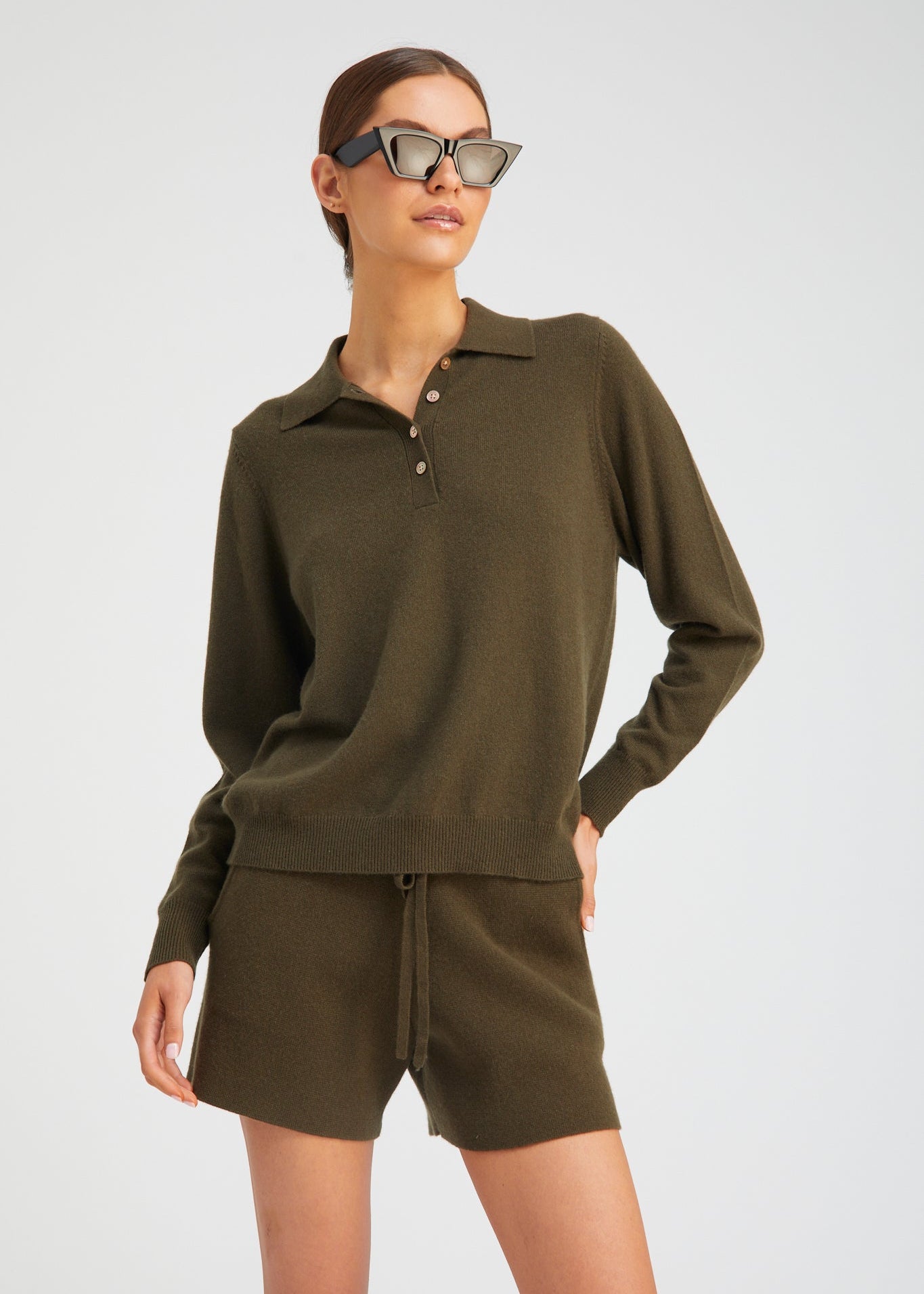 person wearing Sablyn womens Cashmere Polo Sweater in Olive