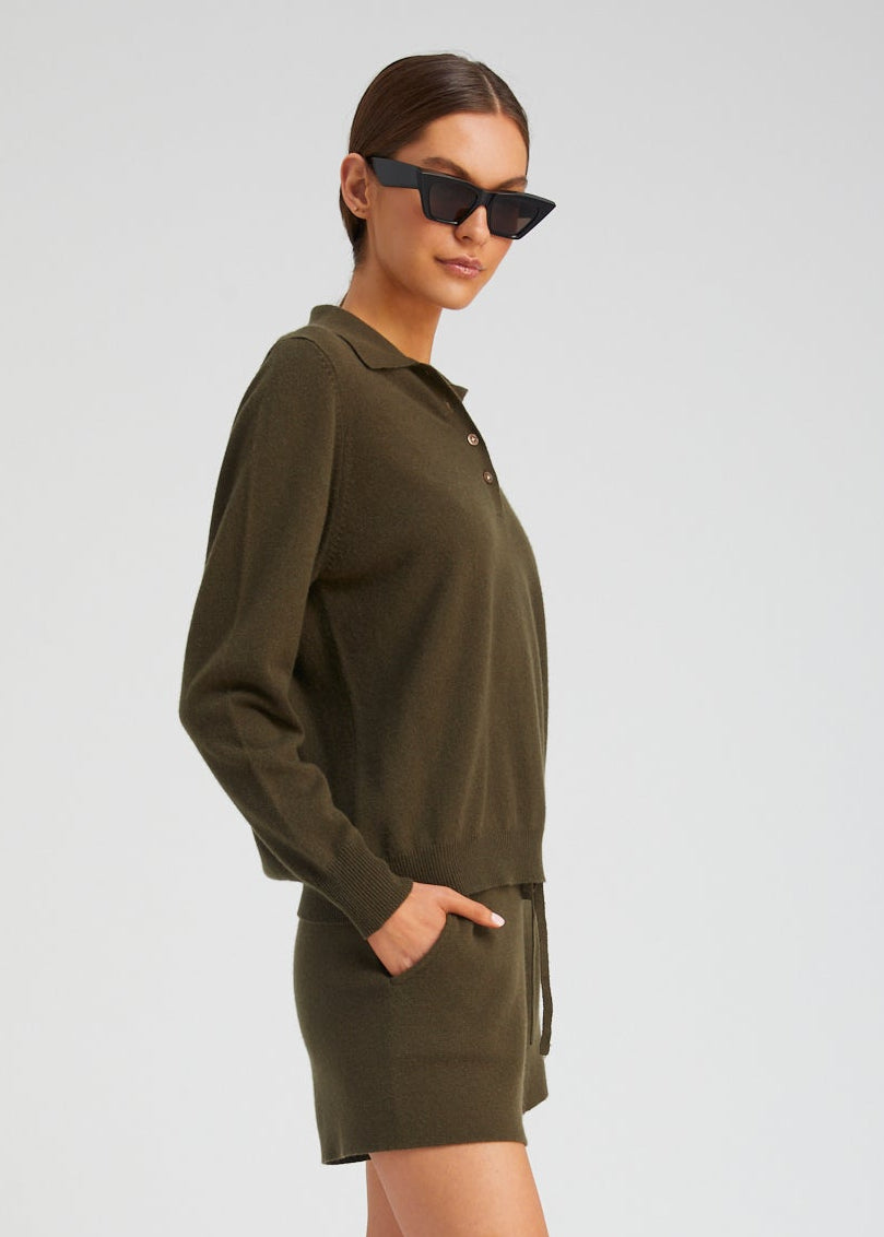 person wearing Sablyn womens Cashmere Polo Sweater in Olive