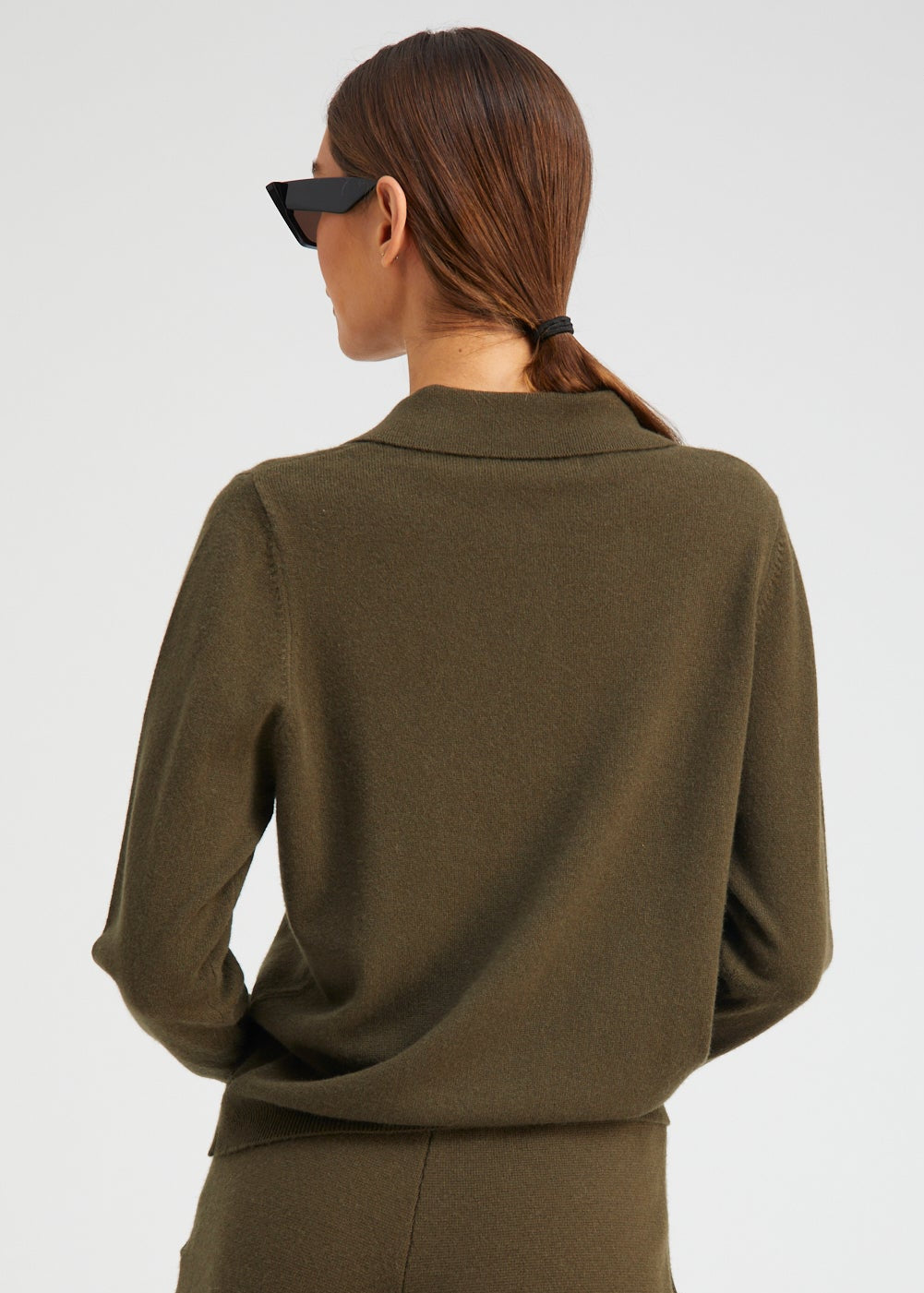 person wearing Sablyn womens Cashmere Polo Sweater in Olive