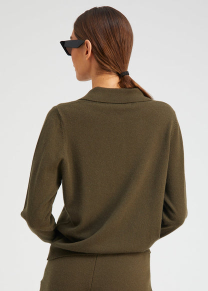 person wearing Sablyn womens Cashmere Polo Sweater in Olive