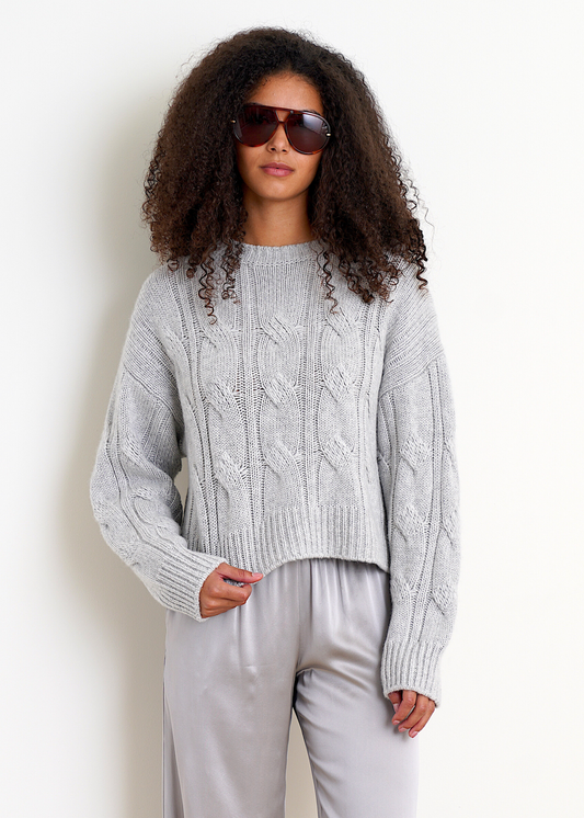 Person wearing Sablyn womens Tristan Cashmere Crewneck Cable Pullover in Foggy