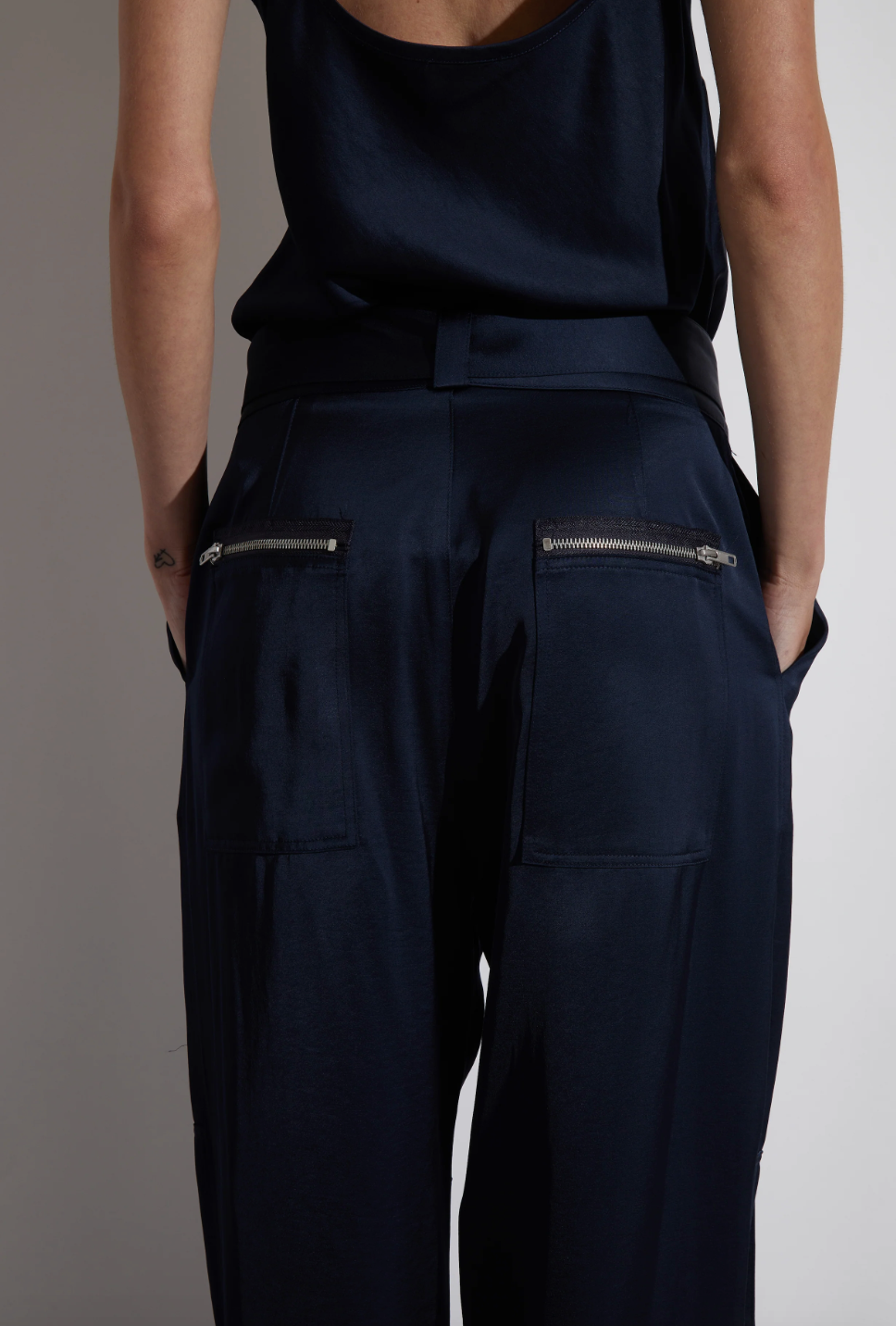 Person wearing Saint Art Courtney Charmeuse Pant in Navy
