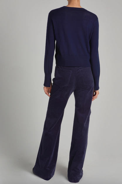 Person wearing Saint Art womens Aron Corduroy Flared Pants in Navy