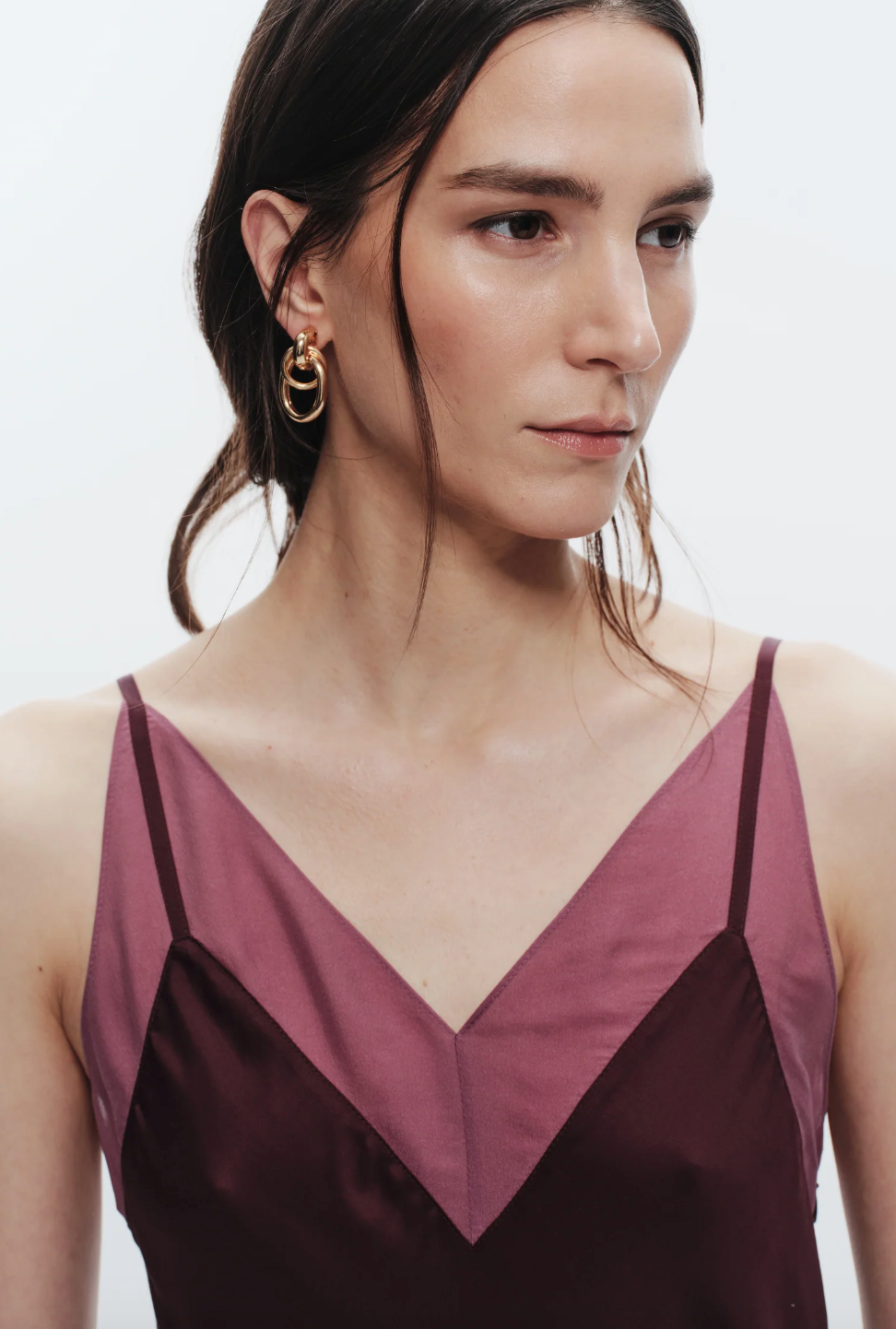 Person wearing Saint Art womens viscose Vinza Slip Dress in grape purple red