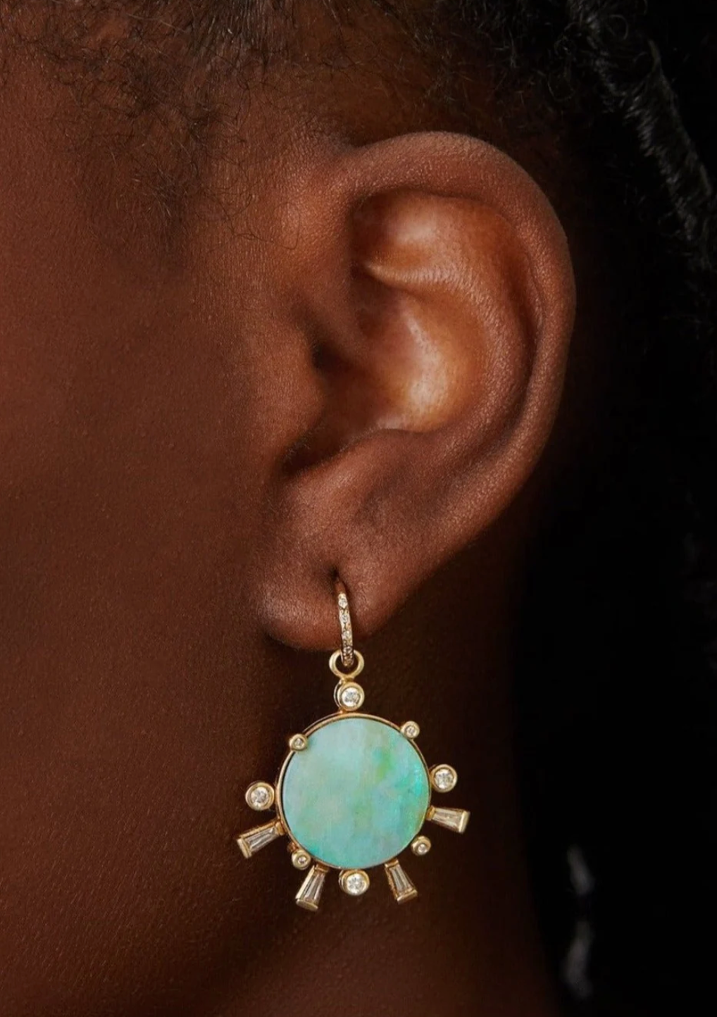 Person wearing Scosha fine jewelry 14k gold Sunset Charm with Opal and Diamonds