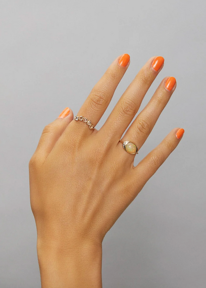 Person wearing Scosha fine jewelry 14k yellow gold Indira Ring with Champagne Diamonds