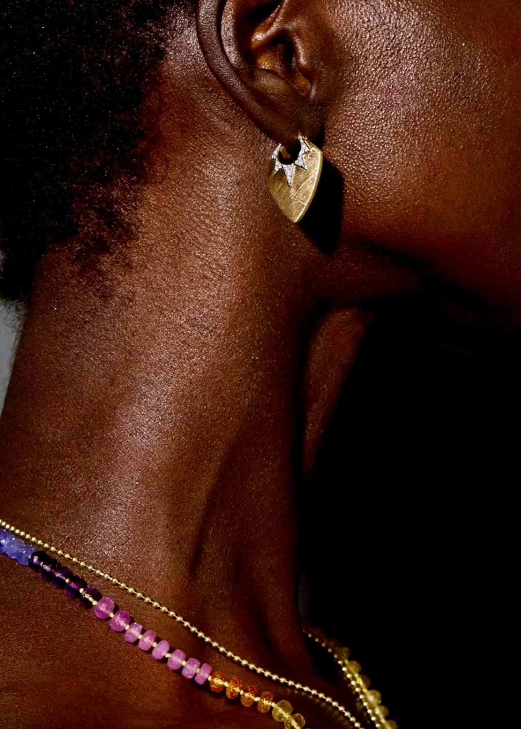 Person wearing Sorellina 18k Yellow Gold and Diamonds Classic Guitar Pick Earrings