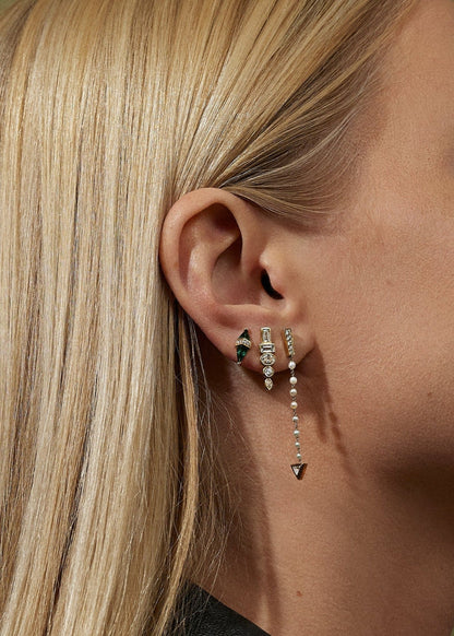 Person wearing Sorellina fine jewelry 18k yellow gold diamond Monroe Totem Diamond Studs