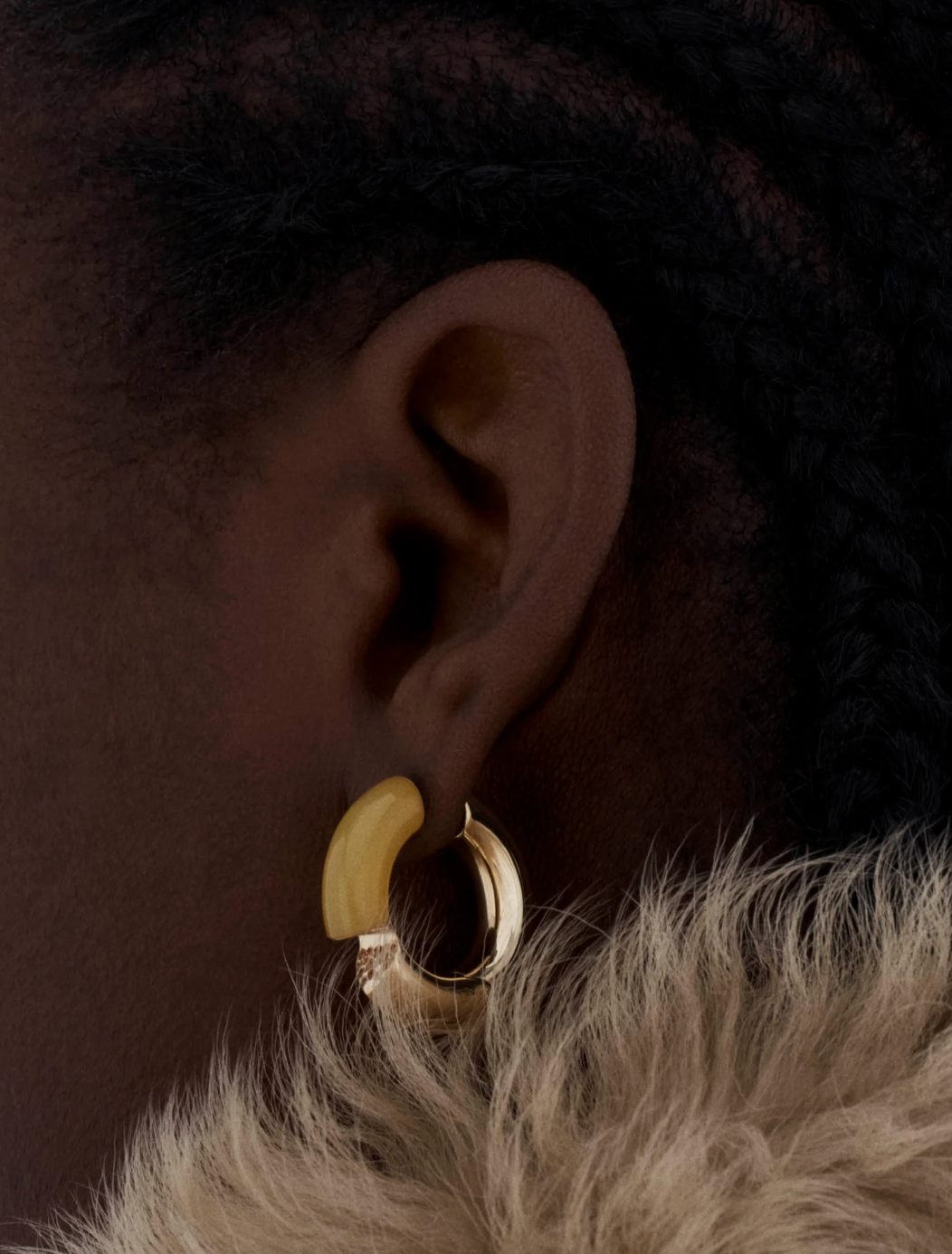 Person wearing Tabayer fine jewelry 18k yellow gold Oera Earrings with Yellow Agate and Sapphires