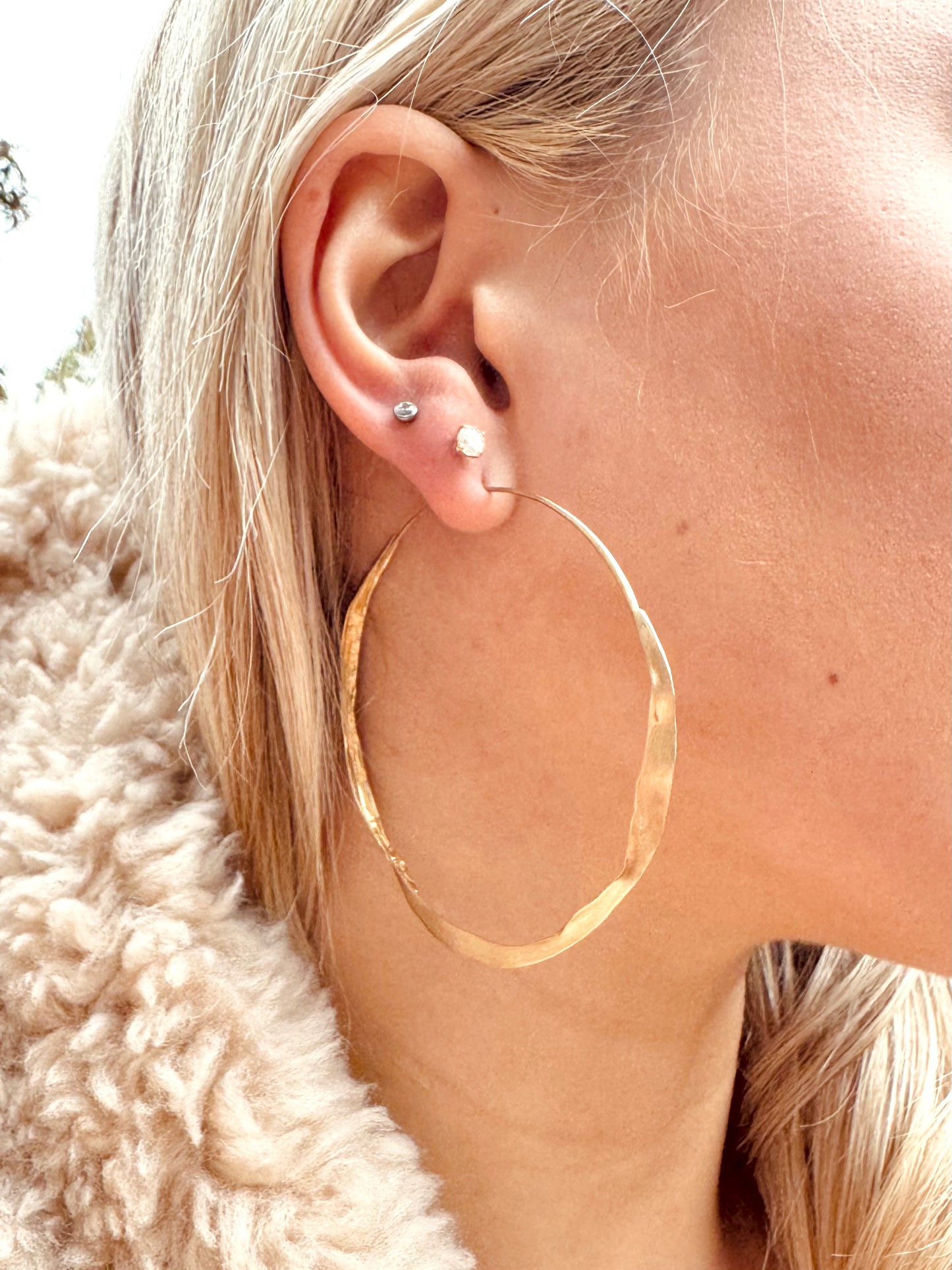 Person wearing Ten Thousand Things fine jewelry 10k gold Large Gold Crinkle Hoops
