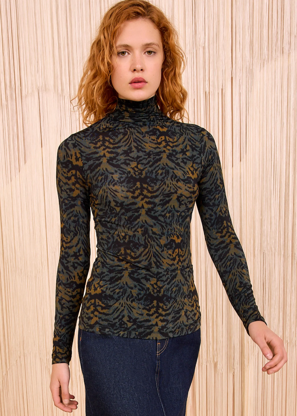 Person wearing Ulla Johnson Aurelia Jersey Turtleneck in Desert Jasper