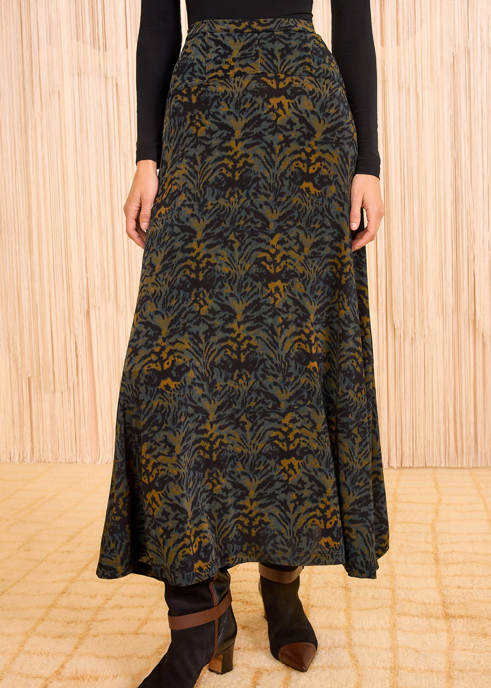 Person wearing Ulla Johnson Paola Jersey High Waist Midi Skirt