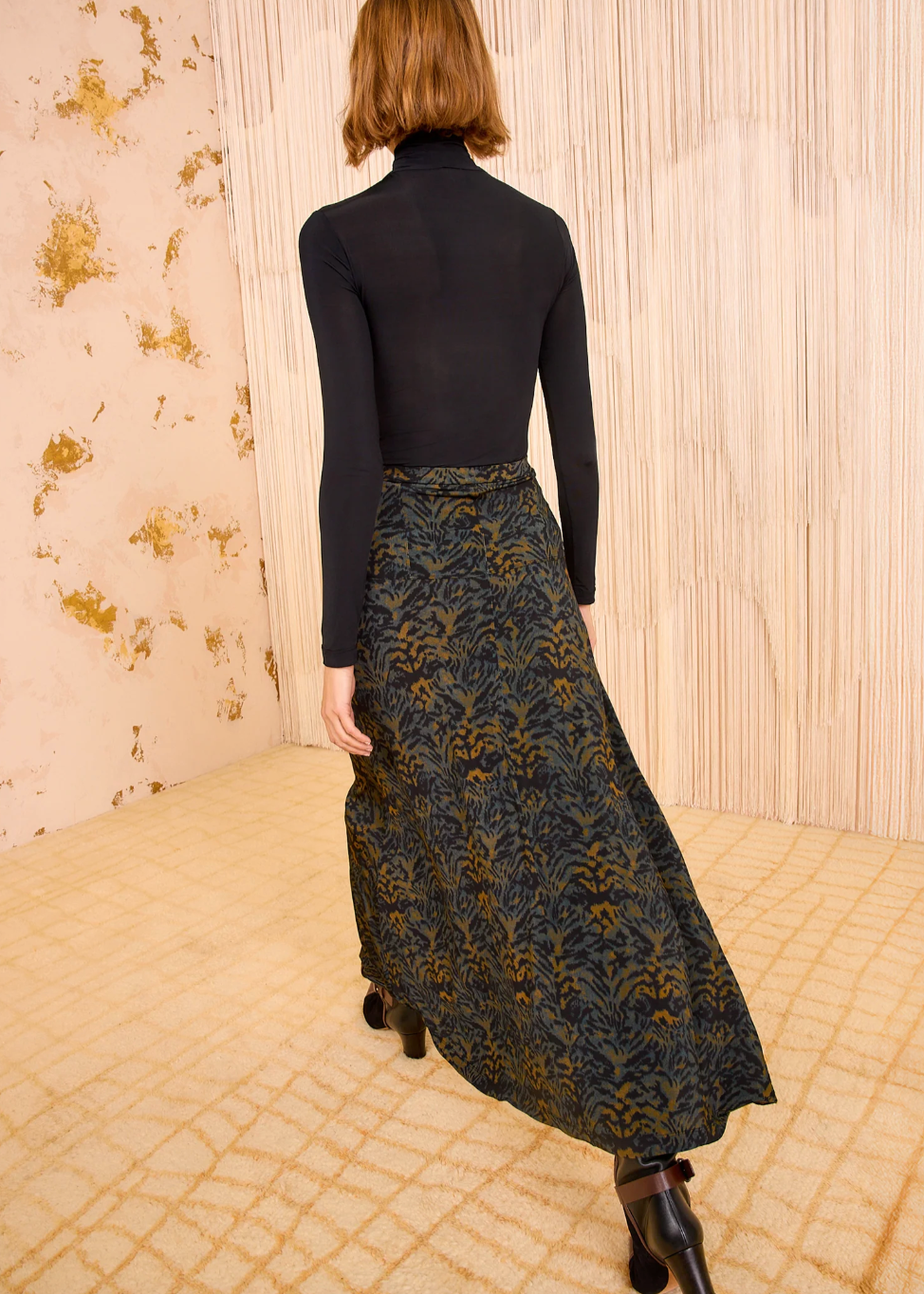 Person wearing Ulla Johnson Paola Jersey High Waist Midi Skirt