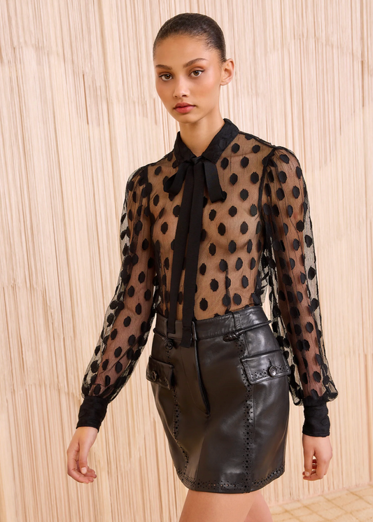 Person wearing Ulla Johnson Soraya Lace Neck–Tie Blouse Black