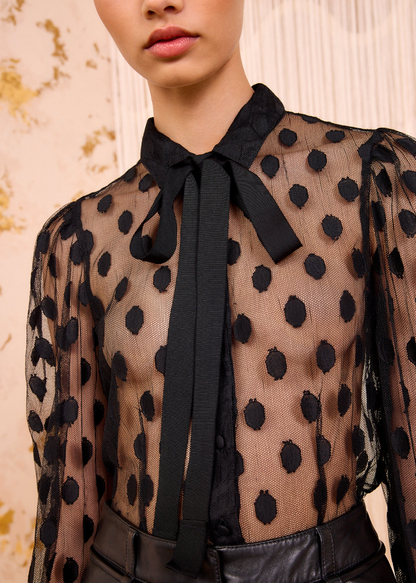 Person wearing Ulla Johnson Soraya Lace Neck–Tie Blouse Black