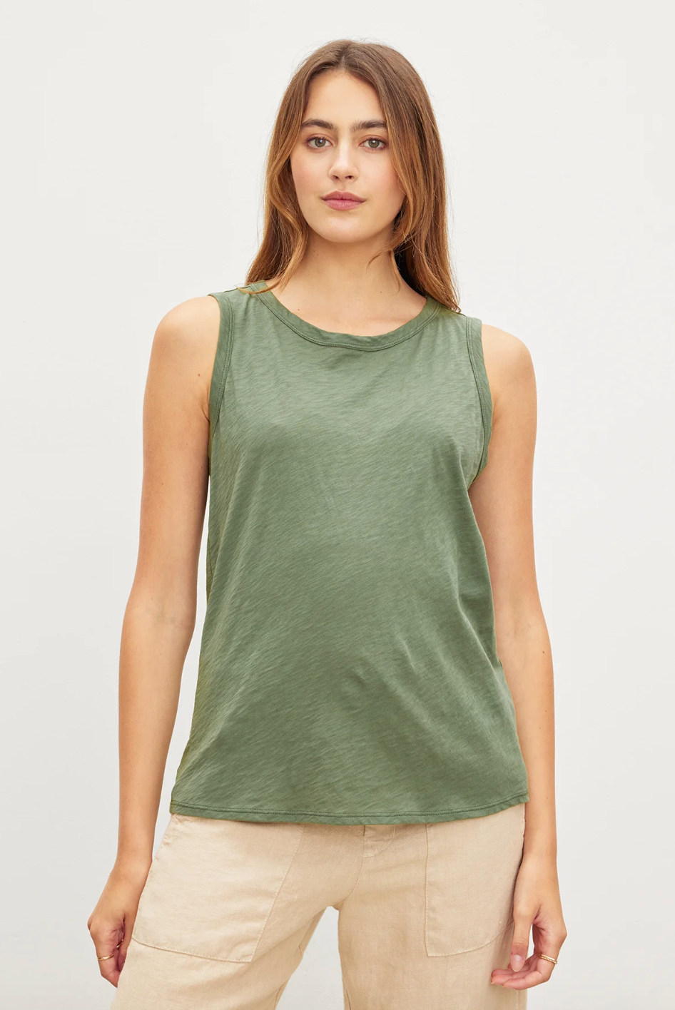 Person wearing Velvet Taurus Tank Top in Desert Green