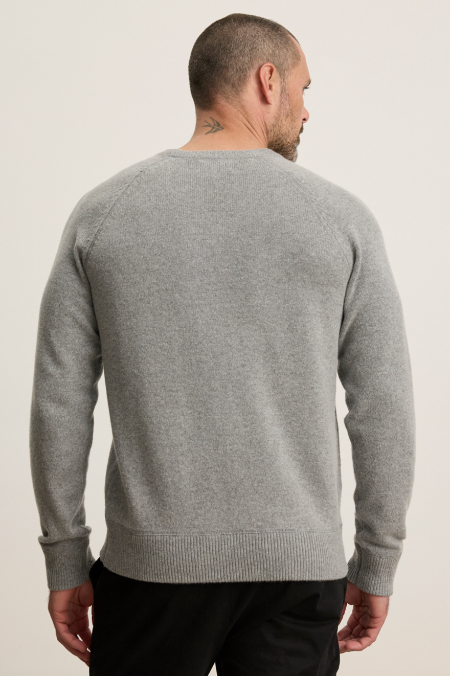Person wearing Velvet tees mens Cortez Crew Neck Sweater Heather Gray